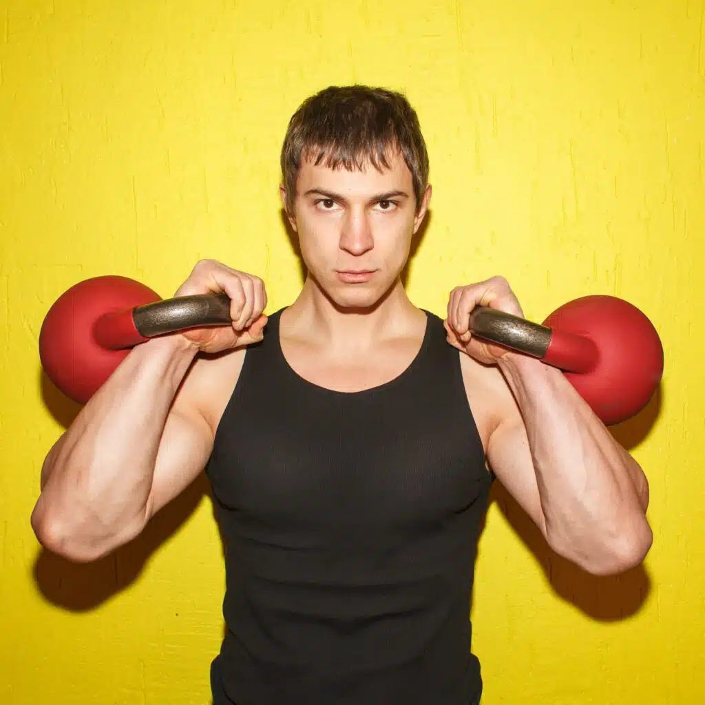 brutal muscular guy with weights isolated